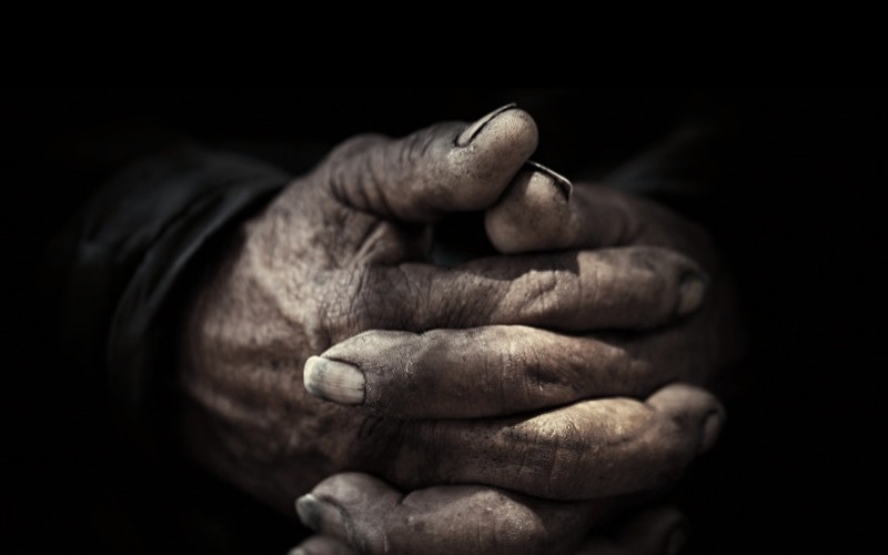 old weathered praying hands