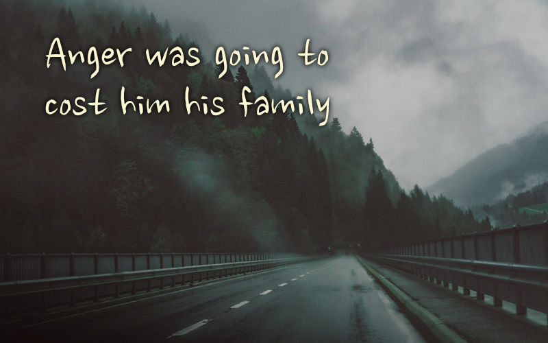 Driving across bridge in mountains when rainy and grey