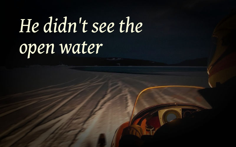 snowmobile on frozen lake heading for open water