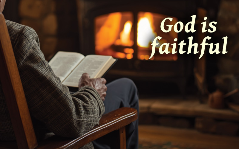 elder sitting in chair in cabin, reading Bible