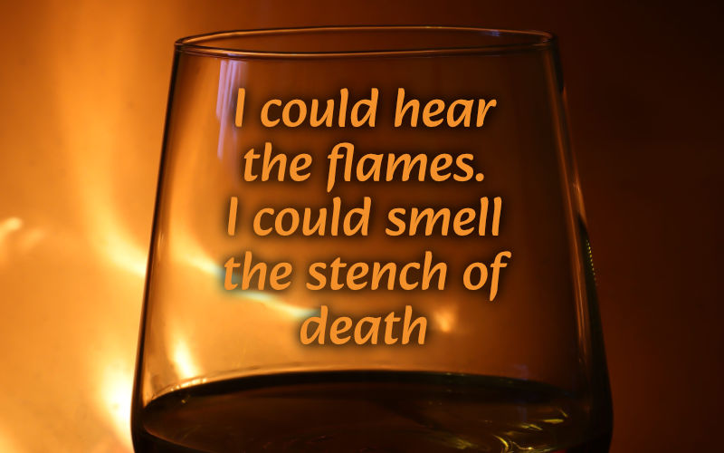 glass of whiskey with fire in background